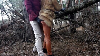 Blonde in fur and leather spreads bare in winter forest during risky outdoor encounter