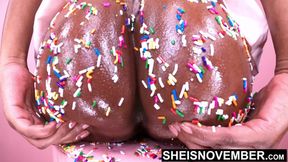 Shimmering ebony babe spreads her shaved pussy and big booty