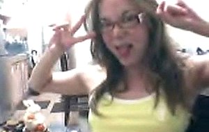 Cute brunette in yellow teasing on cam