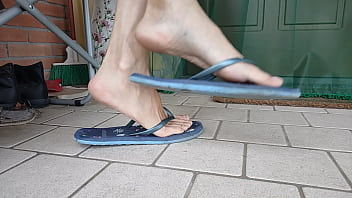 Dangling and shoeplay with female flip flops and sandals