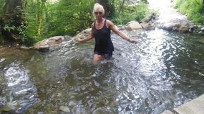 Alexa Cosmic Trans Girl Swimming in Font Near Waterfall Wearing Shorts and T-shirt...