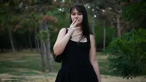 Raven-Haired Tattooed Beauty Teases Outdoors With Glass Toy