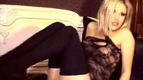 Super seductive blonde babe in black stockings is toying her wet pussy