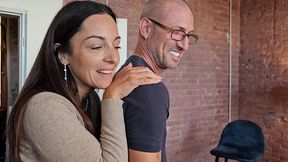 behind the scenes, two hot brunettes challenge each other at billiards