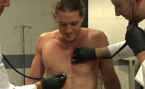 Kip Johnson is oiled up and used by two horny doctors