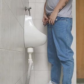 Risky jerk in public urinal at work