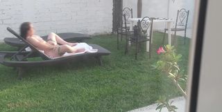I Recorded My Stepsister Sunbathing Naked and Masturbating in the Garden