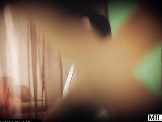 A sunbathing trophy wife seduces a peeping tom.