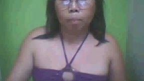 Mature ugly Aisan lady on webcam touching herself between legs