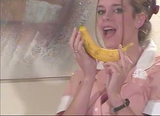 Horny waitress takes her uniform off and plays with a banana