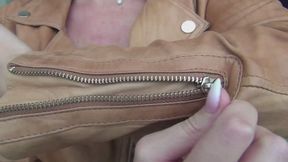 I zip and unzip my favorite red leather jacket a