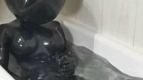 Ballhood rubberdoll masturbates in bathtub