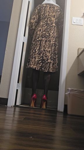 Red high heels and leopard dress