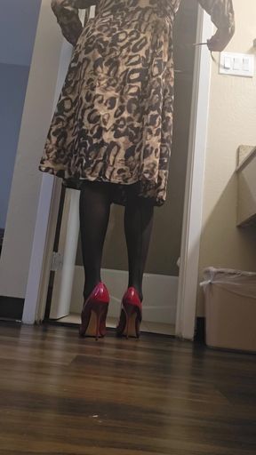 Red high heels and leopard dress