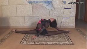 Teen stretches her legs and body showing huge tits