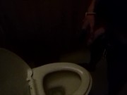 Guy pisses in a public toilet