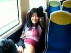 Asian milf rubs her clit on a train.