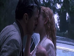 Drew Barrymore making out with a guy on the hood of a car