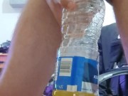 Pissing in the empty bottle like a champ