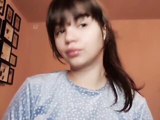 Brunette hair with natural large lips with natural color lipgloss smokin' a cigarette blowing smoke in your face