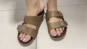 showing off my feet in leather flip-flops