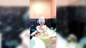 Stepmom Soaks In The Tub And Teases Her Large Breasts