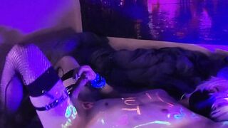 Slutty femboy makes a mess with his cum under ebony lights