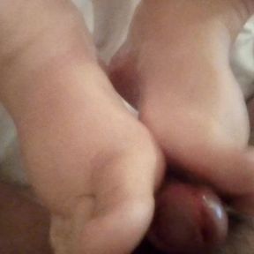 John is getting a Footjob from Jen