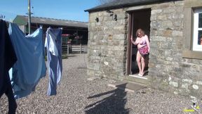 Trisha hanging out the washing