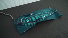 Hard bondage mummification tape corset in a blue latex vacuum trap