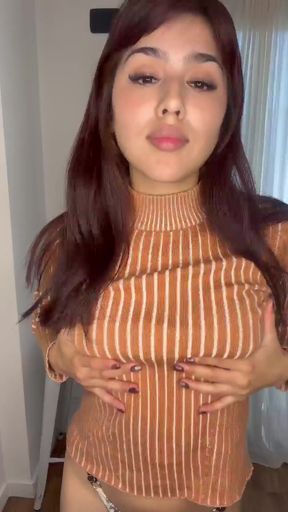 Brown turtleneck top, brunette hair