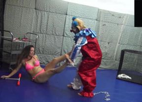 Bikini brunette babe gets ******** by weird lezdom under clown costume