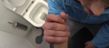 Cute guy sucks dick in a public restroom