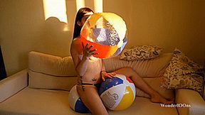 New girl inflates and pops beach balls Full HD