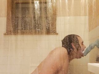 Sucking a bad dragon toy in the shower