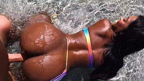 Ebony beauty gets her anal fucked by a white friend on the beach