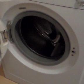 John is peeing all into the washing machine