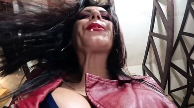 Busty MILF smokes while licking the lens dripping saliva all over her leather jacket