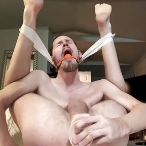 Pretzel faggot bounces on dildo and gapes hole