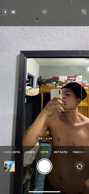 Young Latino Boy Posing in Front of the Mirror