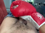 Gay jerking off with boxing gloves.