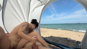 My Asian GF sits on a public beach, jerking my cock while I'm naked
