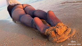 Sea Waves Gently Kiss the the Goddess Feet in Black Pantyhose at Sunset