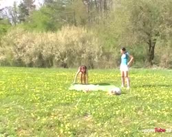 Two girlfriends playing together outside. They take playing together very literally!