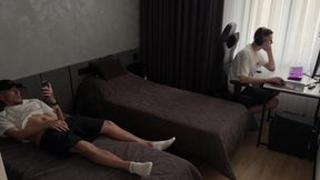 Guy jerks off dick while his friend is busy
