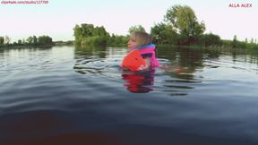 Alla swims on the lake and wears a rare inflatable vest and inflatable armbands for safety!!!