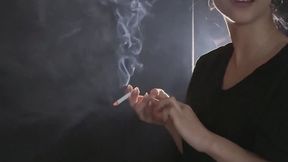 HANDY - SMOKING WITH LEGS CROSSED AND CHEWING GUM
