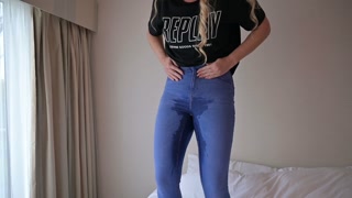 girl peeing in jeans and they are wet