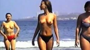 Some of the girls just like enjoying the beach topless
