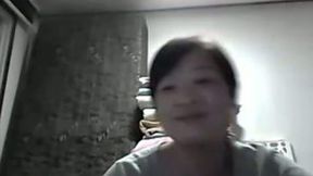 Webcam solo with Chinese chick flashing her natural boobs